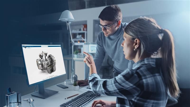 Arbeitskollegen am Bildschirm CATIA Zwei Arbeitskollegen betrachten CATIA-Modell am Bildschirm