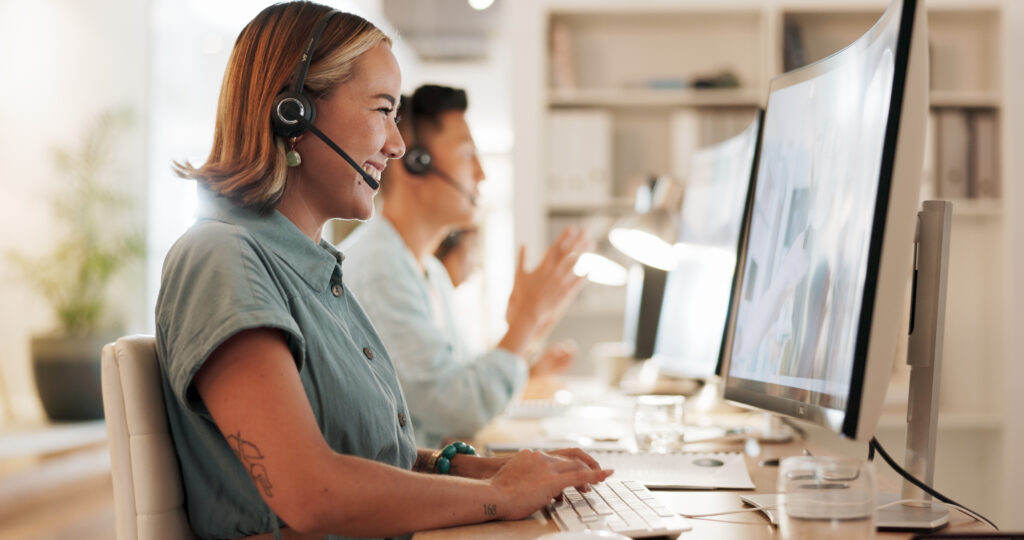 Call center, consulting and laughing with woman in office for contact us, communication and customer service. Salesman, help desk and technical support with person in crm agency for telemarketing.